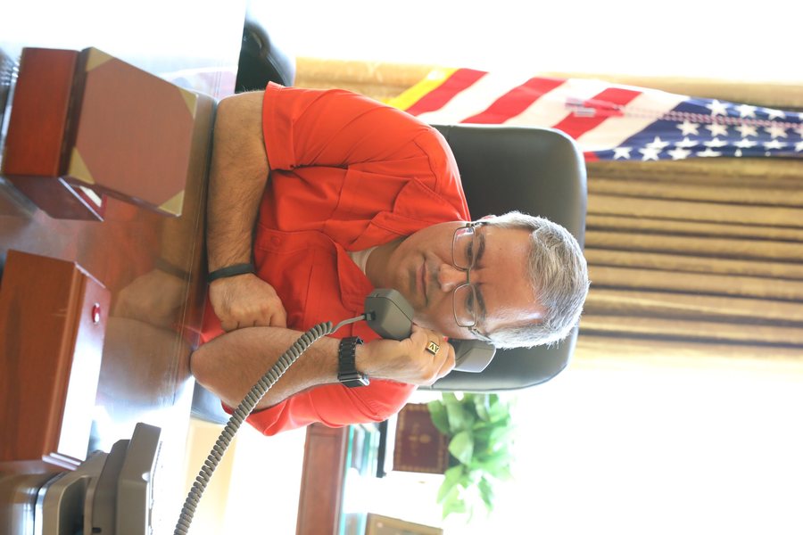 Ceremonial trumpet performance with United States flags