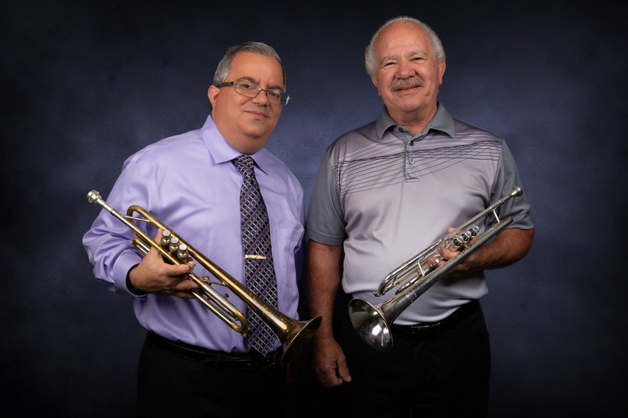 Allen J. Venezio with his father, Al Venezio, both holding trumpets